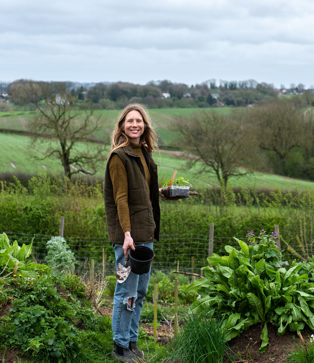 Flower farmer holding plants yorkshire 